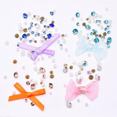 China Beautiful New Arrival Bow Pearl Diamond Ornaments Nail Art Set Bowknot Ribbon 3D Diy Bow Tie Rhinestone Nail Art Accessories for sale