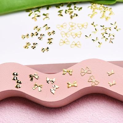 China Giltter Hot Selling Six Shapes Metal Butterfly Bow Nail Art Jewelry Butterfly 3d Nail Art Charms for sale