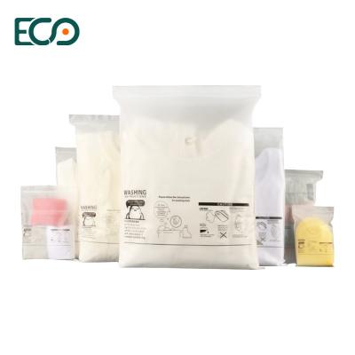 China Recyclable Wholesale Custom Plastic Logo Slide Frosted Zip Lock Apparel Packaging Bag With Zipper for sale