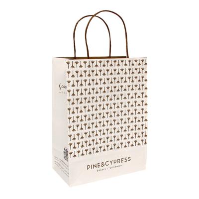 China Cute Paper Biodegradable Biodegrable Shopping Bag The Dot Grid Wave Logo Printed Paper Bag for sale