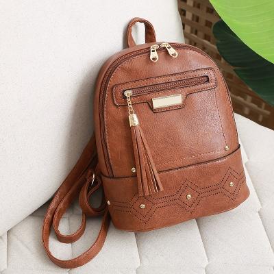 China Waterproof Women PU Leather Backpack Vintage Tassels School Backpack For Teenagers Geometric Hollow Rucksack for sale