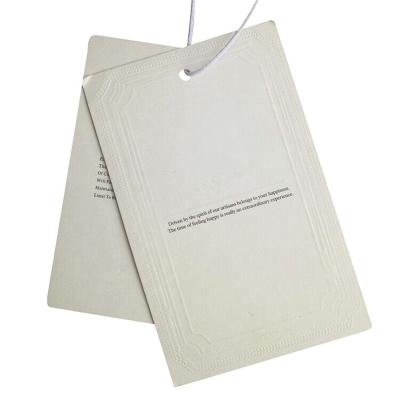 China Sustainable Custom Hanging Transparent Apparel Price Card Apparel Paper Tags for sale