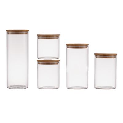 China Round 500ml Round 500ml Kitchen Viable Food Storage Box Empty Clear Glass Candle Containers Jars With High Borosilicate Lids Bamboo Wood Set for sale