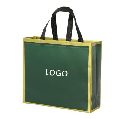 China Hot Selling Tote Bag Custom Dark Green Nonwoven Folding Gold Rim Shopping Gift Bag Clothing Packaging Tote Bag With Logo for sale