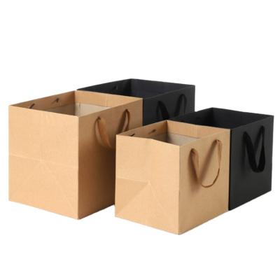 China Recycled materials plain square horizontal recyclable black brown kraft paper recycled paper carry bag for clothing and apparel shopping carry bag for sale