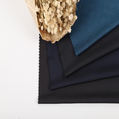 China Stretch Jacquard Mesh Fabric Polyester Mesh Fabric Cationic Solid Knitted Honeycomb Fabric for sale