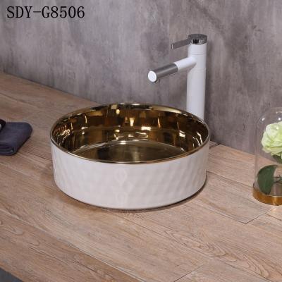 China Rustic Ceramic Gold Sliver Rose Gold Color Wash Sink Bathroom Sink Small Gold Colored Wash Basin for sale