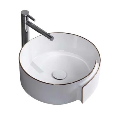 China Gold Line Ceramic Wash Basin Mid Century Gold Color Bathroom Sink Design for sale