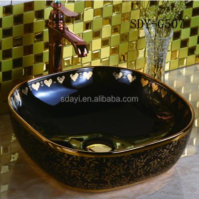 China Traditional GOLD color black bathroom wash sink gold ceramic basin price in pakistan for sale