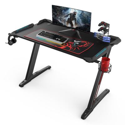 China Other Youngest Electronic Competition Design Z Shape Leg Desk With Blue Carbon Fiber LED Lights Gaming Desk for sale