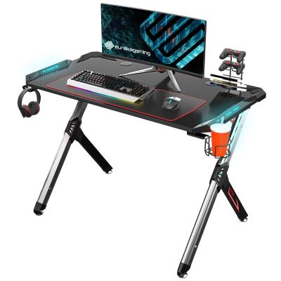 China Other R Shape Leg Design P2PB Desk With Carbon Fiber Texture PC Gaming Desk With Six Color RGB LED Lights for sale