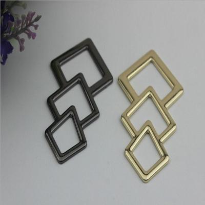 China Novelty design triangle pattern gold & gunmetal zinc alloy metal logo plate for shoes accessories for sale