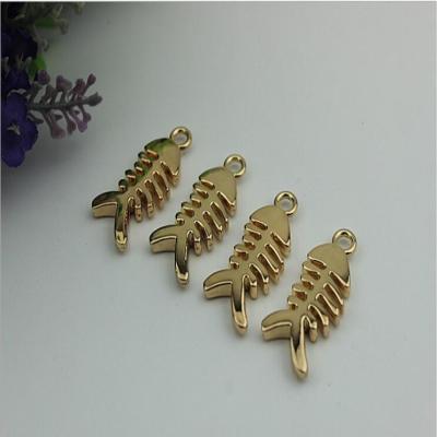 China Small light gold fish bones pattern zinc alloy metal handbag logo label tags for sales for sale