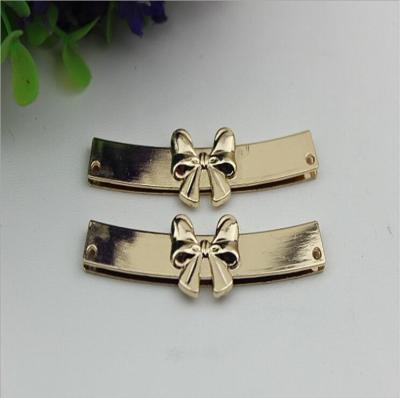 China OEM zinc alloy light gold bow-knot shape purse decorative metal corner 65 mm for sale