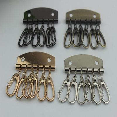 China Leather Key Case Wallets Unisex Keychain zinc alloy Key Holder Ring with 6 Hooks Snap Closure for sale