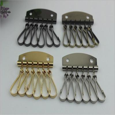 China Fashion Style Leather Key Chain Zipper Card Wallet Unisex Iron gold Keychain Holder with 6 Hooks Snap Closure for sale