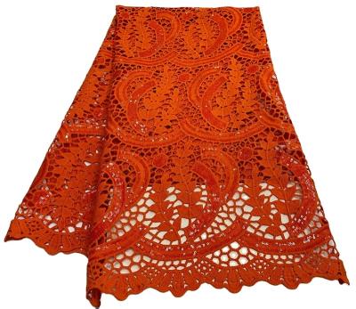 China Beautiful Breathable African Fabric African Lace Fabric Water Soluble Brown Orange Fabric With Sequin Beads Swiss Lace Ladies Skirt for sale