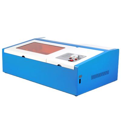 China Laser Engraving Best Price 40W CO2 Laser Engraving Machine With Rotary Laser Cutting Machine 300*200mm for sale