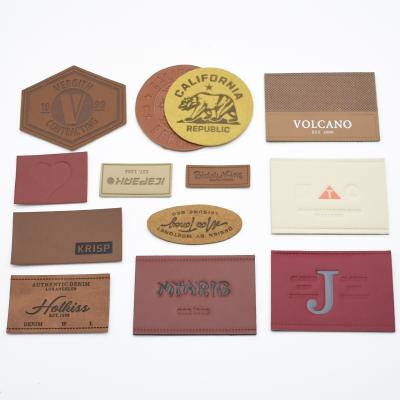 China Embossed leather patch and durable custom jeans leather label and tags for clothing for sale