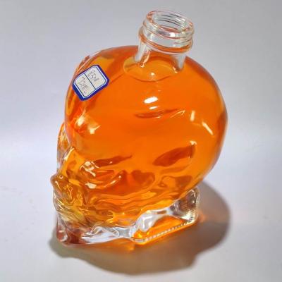 China Custom Clear Glass Beverage Wine Bottle Skull Glass Bottle Liquor Bottle Glass for sale