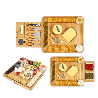 China Factory Direct Chopping Luxury Logo Set Drawer Stored Customizable Cutlery Portable Turn Cheese Bamboo Cutting Board With Handle for sale