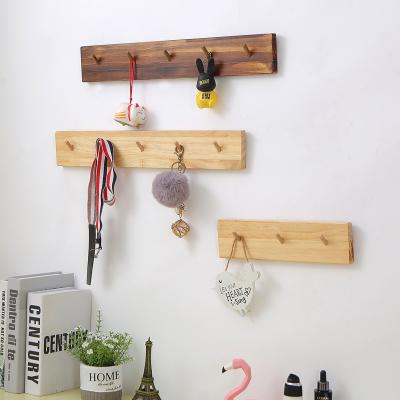 China Clothes Viable Household Multiple Solid Wood Rack Behind Wooden Beech Wall Hanging Word Coat Hanger Hook for sale