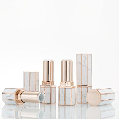 China Wholesale empty tube 12.1mm white and gold marble octagonal cosmetics lipstick tube for lip balm in stock for sale