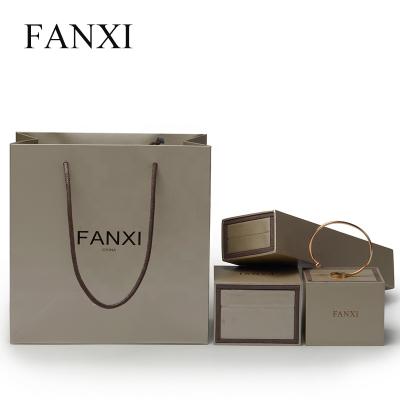 China FANXI Logo Color Printed Luxury Paper Recyclable Wholesale Custom Jewelry Gift Bag Packaging Bags With Handle Recycle Paper Shopping Bag for sale