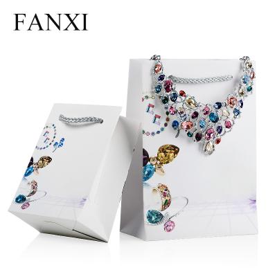 China Custom Security FANXI Logo White Color Handle Jewelry Bag For Counter Gift Packaging Printing Paper Bag for sale