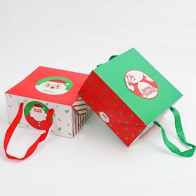 China Recyclable Merry Christmas Candy Bag With Handle Christmas Decoration Birthday Party Gifts Packaging Santa Claus Paper Bag for sale