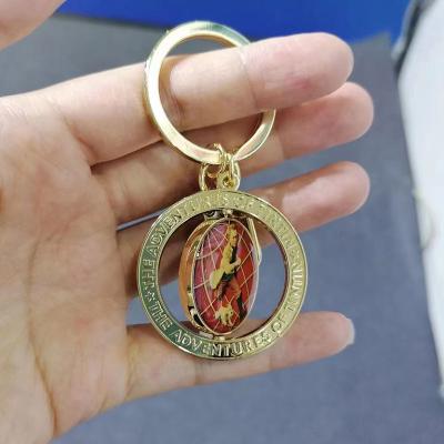 China Souvenir Gifts Promotion Gold Plated Keychains With Rotating Limb In The Center Metal Sport Accessories Custom Key Ring for sale