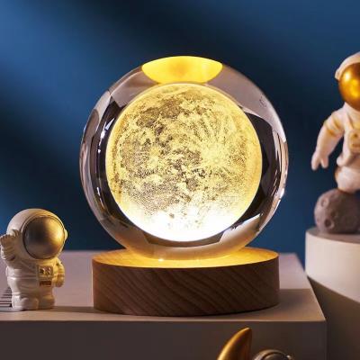 China China 8cm Laser Engraved Moon Earth Cloud Crystal Magic Ball Light Led Rain Night Lights Crystal Ball With Wooden Stand for sale