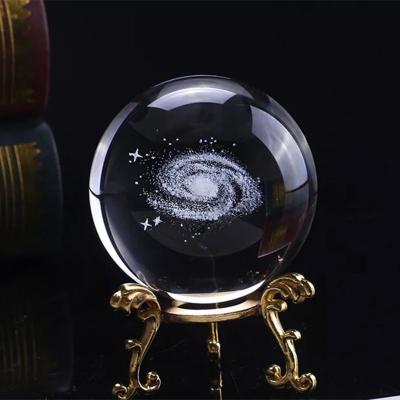 China Hot Sale 3D Cheap Decorative Design China 60mm Good Reward Laser Engrave Solar System Galaxy Universe Crystal Glass Ball With Base for sale