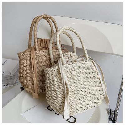 China Fashion Travel Bohemian Straw Bags Ladies Vocation 2021 Summer Beach Bucket Bag Handmade Woven Drawstring Luxury Handbags For Women for sale