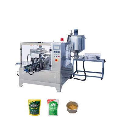 China Premade 8 Station Automatic Pouch Vinegar Zipper Food Rotary Packing Machine With Piston Filler Liquid for sale