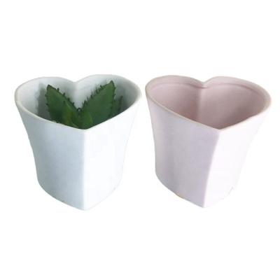 China Eco-friendly Pink Heart Shape Small White Unglazed Clay Flower Pots For Succulent Plants Cactus for sale