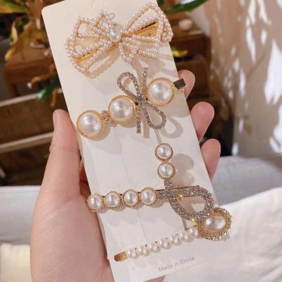 China Japan clip platypus clip set simple source manufacturer and new XI Feng Korean style XI Feng Korean style fashion pearl bow hairpin for sale