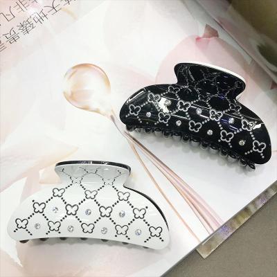 China Fashion Black And White Acrylic Hair Claw Clip Concave Engraved Butterfly Claw Clip Rhinestone Fashion Hair Claws for sale