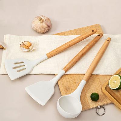 China Eco - Friendly Silicone Kitchen Slice Slotted Turner Ladle Cooking Utensil Set With Wooden Handle for sale