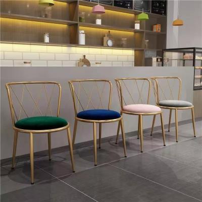 China Antirust Seamless Welding Velvet And Metal Dining Chairs Gold Legs for sale