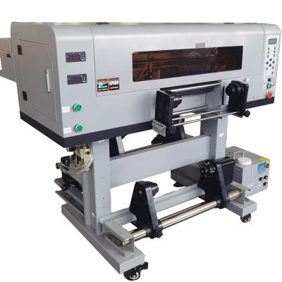 Cina Stampa DTF UV da 60 cm a 70 cm con tre teste TX800 3200 Epson AB Film UV Roller Machine Piccola in vendita