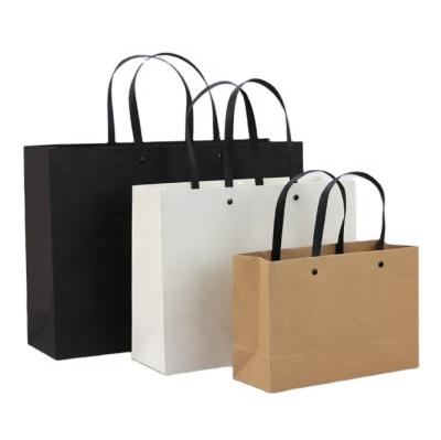 China Recycled materials wholesale luxury black and white logo printing logo shopping bag packaging gift jewelry custom paper bag for sale