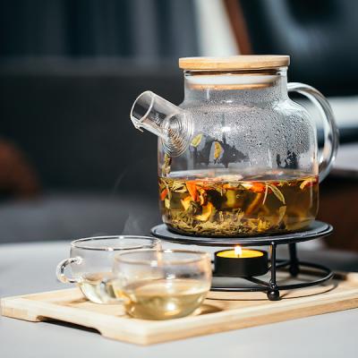 China Sustainable Mini Ceramic Teapot Asian Infuser Borosilicate Clear Glass and Ceramic Porcelain and Bamboo Stand Lid with Candles for sale