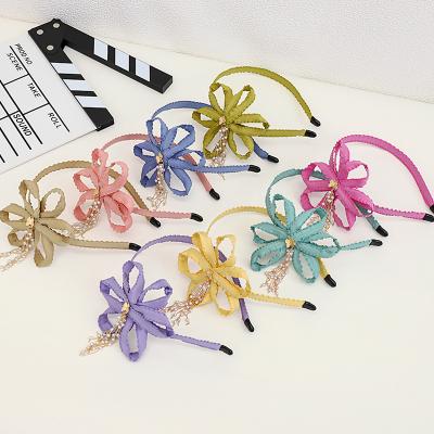 China PRETTY Latest Stylish Hair Accessories Flower New Designer Headbands Solid Color Braid Headband Tassel Flower Pearl Headband for sale