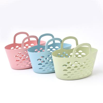 China Sustainable Plastic Fashion Hand Bath Shower Storage Portable Bathroom PP Bath Storage Basket With Handle for sale