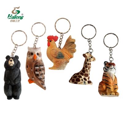 China All The World Custom Handmade Carving Gift And Souvenir Wood Animal Key Chain for sale