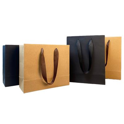 China Recyclable thickened kraft paper bag with printed LOGO clothing accessories gift packaging shopping portable for sale