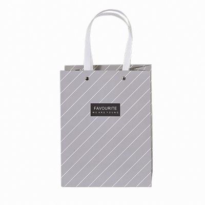 China Recyclable Nordic Style Gift Bag Neutral Black And White Gray Plaid Stripes Simple Rivets Portable Packaging for sale