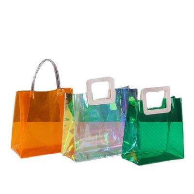 China Laser Recyclable Fancy Portable Gift Transparent Packaging Shopping Bag Custom Bags With Logo Plastic for sale