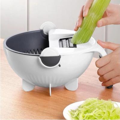 China Sustainable Magic Multifunctional Rotate Vegetable Cutter With Drain Basket for sale